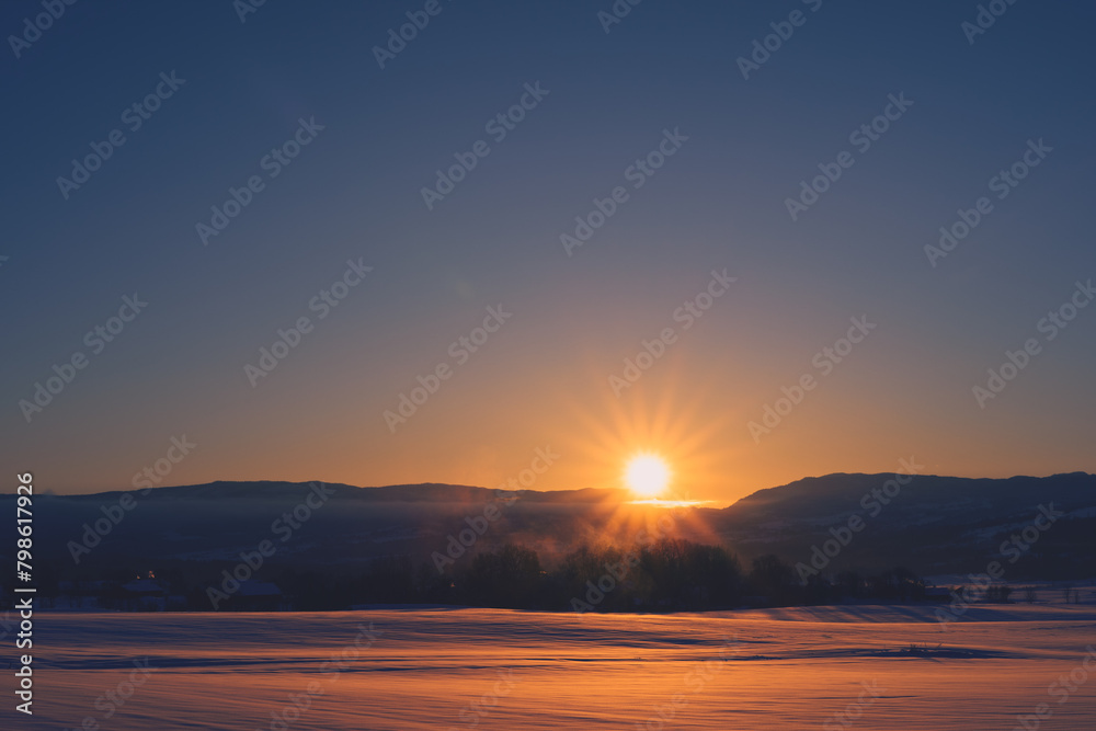 Sunrise above the Totenaasen Hills in winter. Sunrise above the Totenaasen Hills in winter.
