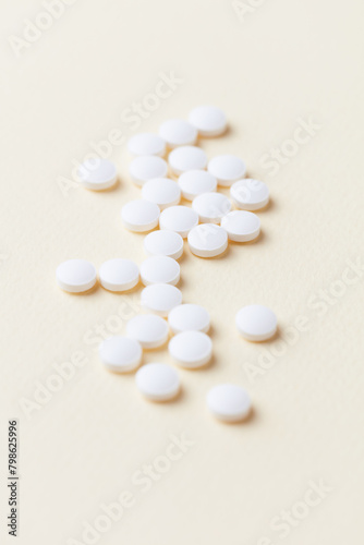 Biotin Tablets. Bright paper background. Close up. 