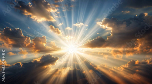 A golden sun is shining through the clouds, casting light and creating a halo effect. The sun is surrounded by rays that appear to be coming from it photo