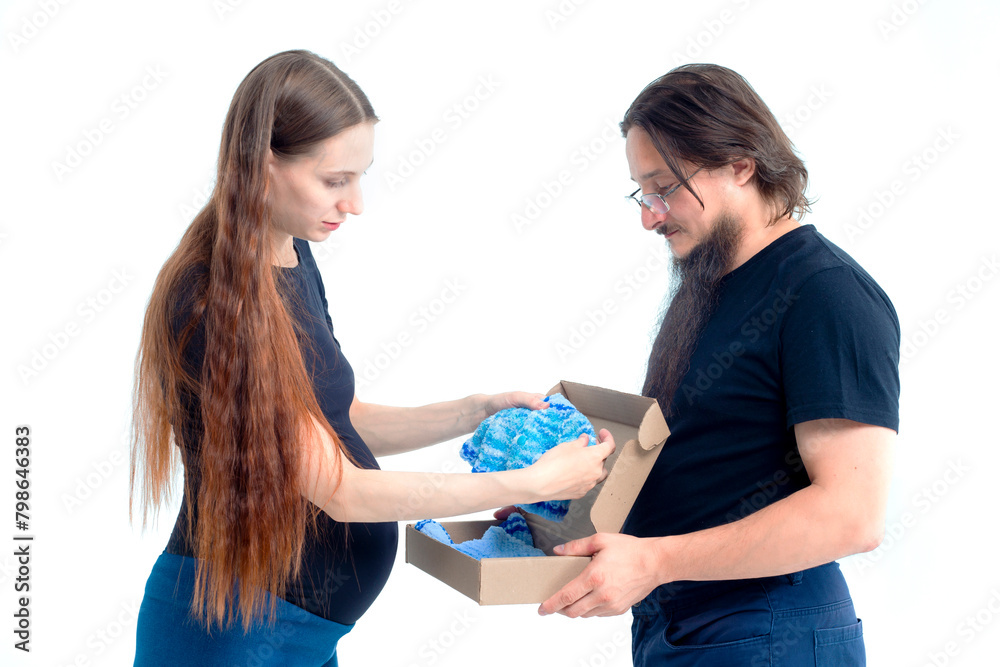 Portrait happy young pregnant woman and her husband with shopping bags and touching her big belly isolated on white background. Pregnancy shopping concept happy young family with shopping bags