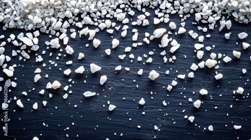   A collection of ice floes resting atop a waterbody, adjoining a snow-covered shore photo