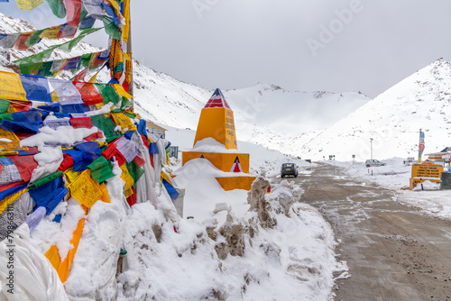 Prayer flags at the summit of Changla Pass at 17,586 feet in the Himalayan Mountains in northern India photo