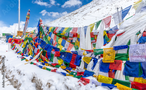 Prayer flags at the summit of Changla Pass at 17,586 feet in the Himalayan Mountains in northern India photo