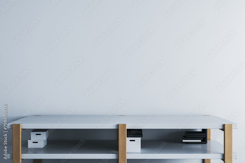 Modern table or tv shelf with items and blank concrete mock up wall for your advertisement. 3D Rendering.