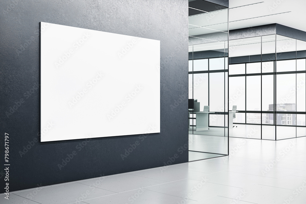 Obraz premium A blank white poster on a dark wall inside a modern office corridor with glass partitions and an outdoor view, concept of advertising space. 3D Rendering