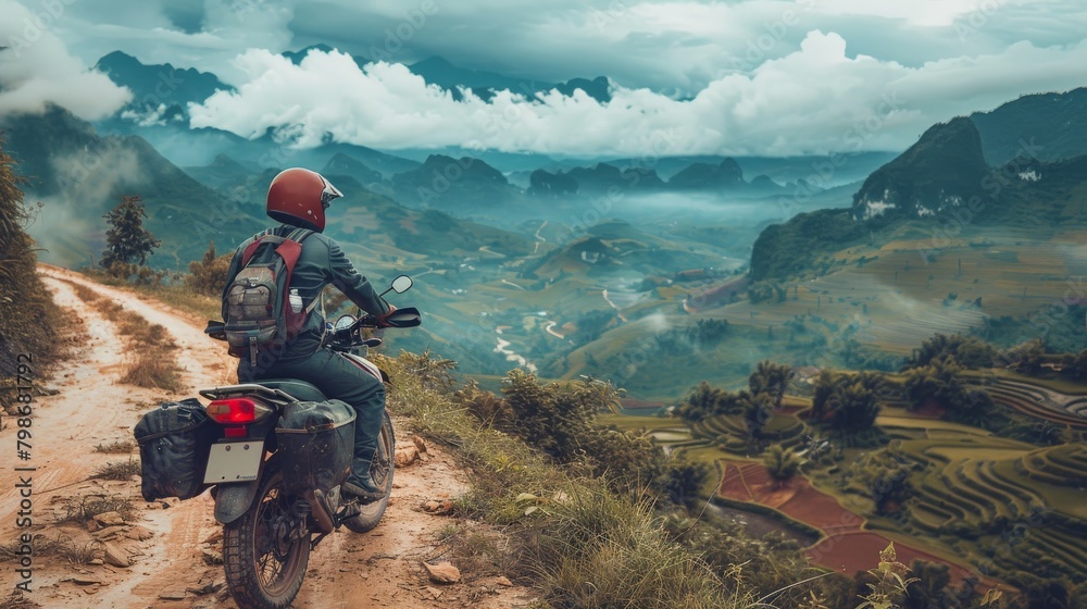 A young explorer navigating the rugged terrain on a motorbike in northern Vietnam A young explorer navigating the rugged terrain on a motorbike in northern Vietnam