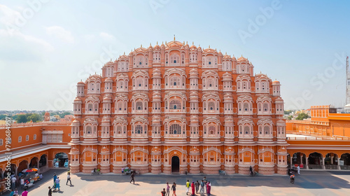 The  Hawa Mahal, or Palace of the Winds, in Jaipur, India. It is a five-story palace built of red and pink sandstone. The palace has 953 windows and is known for its intricate carvings  photo