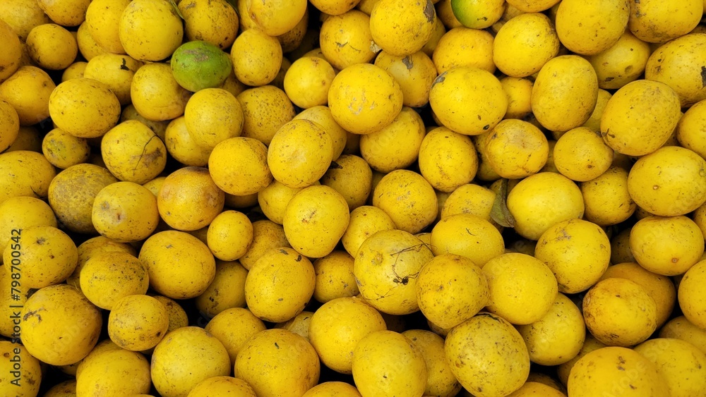 Lemons in the market. Fresh lemon background texure or wallpaper Lemons in the market. Fresh lemon background texure or wallpaper