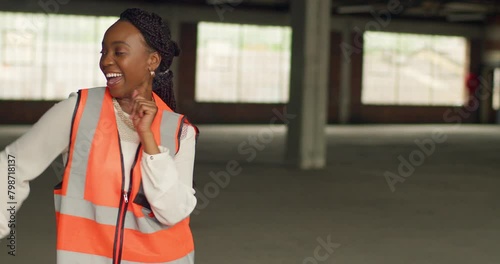 Confident Black Woman Dancing Happily at Urban Construction Site photo