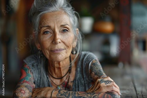 A senior woman covered in tattoos photo