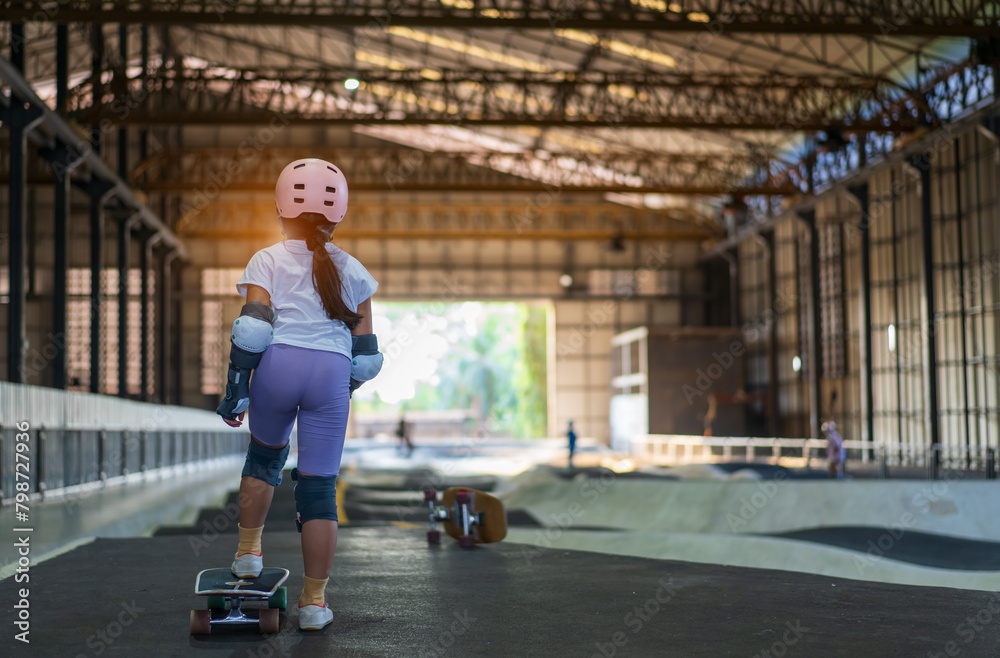 surfskate by asian child skater or kid girl start riding surf skate at indoor pump track to fun playing skateboard in skate park by extreme sports surfing to wears helmet wrist knee guard body safety surfskate by asian child skater or kid girl start riding surf skate at indoor pump track to fun playing skateboard in skate park by extreme sports surfing to wears helmet wrist knee guard body safety