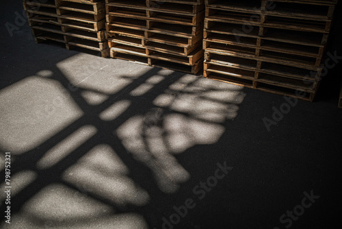 Stacked Pallets - Neatly organized wooden pallets in a warehouse
