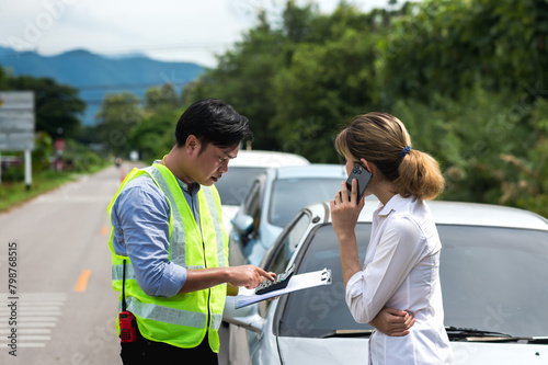 Car insurance agent man asking car owner woman about accident on roadside  © Jack Tamrong