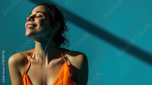 Happy young woman wearing headphones, listening music.
