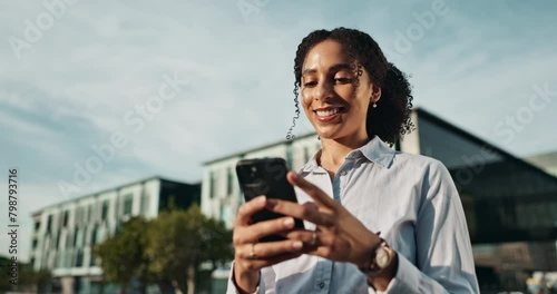 City, corporate and woman with smartphone in nature for communication, networking or job offer. Lawyer, happy and typing on digital technology for email, notification and career in San Fransisco photo