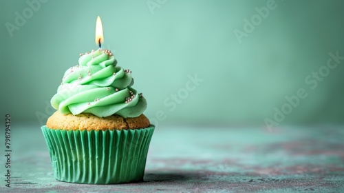 Scrumptious, festive cupcake with green frosting and sprinkles, ready to be enjoyed on a special day. photo