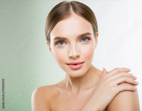 Beautiful face of young woman with perfect health skin; model holding hand on shoulder