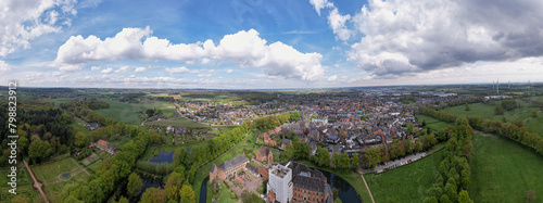 Wide aerial panorama of Huis Berg castle manor in Dutch province of Gelderland seen from above. Medieval brick defense building