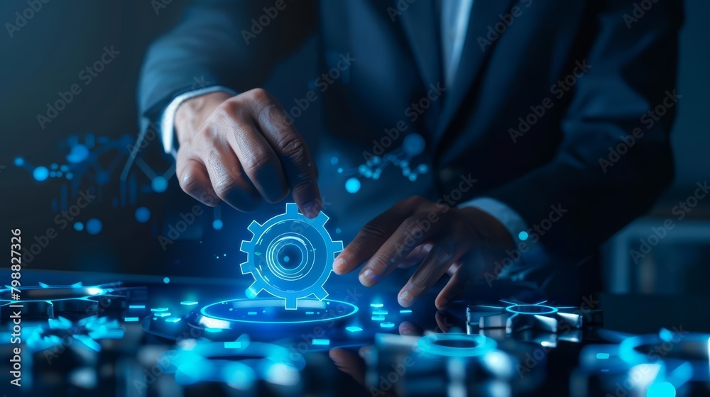 A businessman is working on a project with gears. A businessman is working on a project with gears.