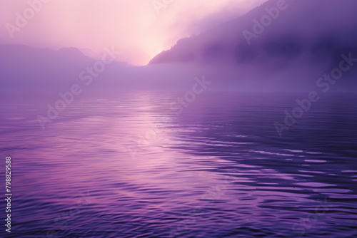 Lago al alba con tonos de luz púrpura.  photo