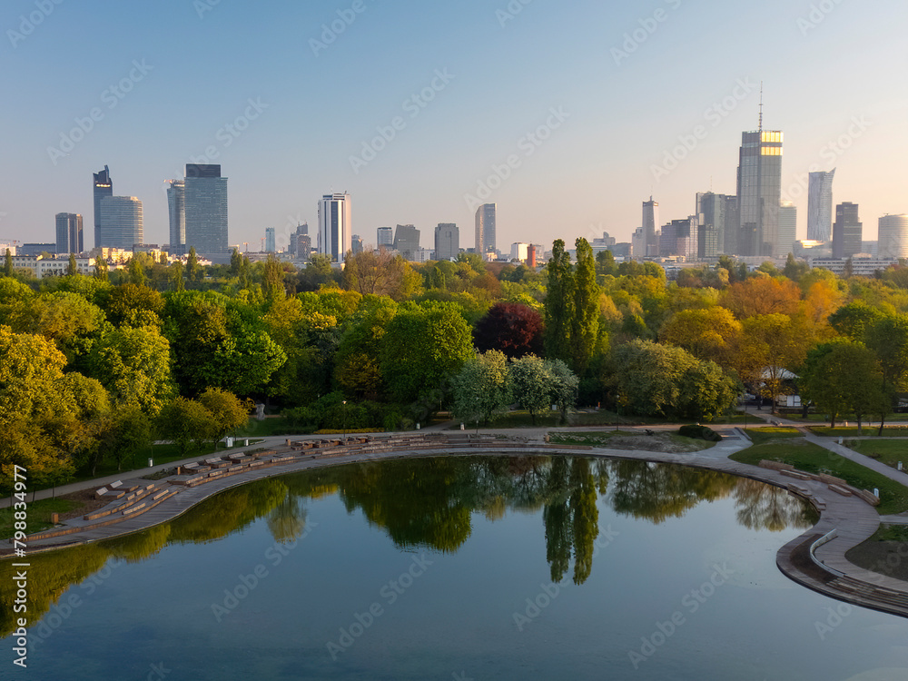 Obraz premium A beautiful view of the sunrise in a fabulous spring morning at Pola Mokotowskie in Warsaw, Poland - 