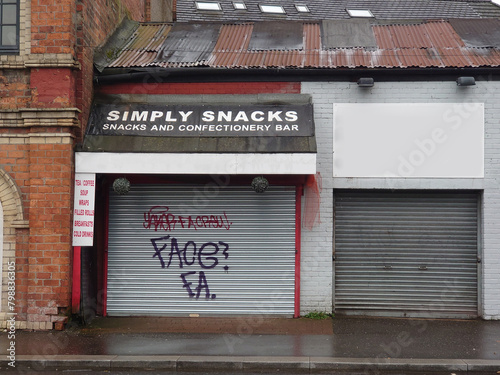 The outside of a closed snackbar with steel shutter