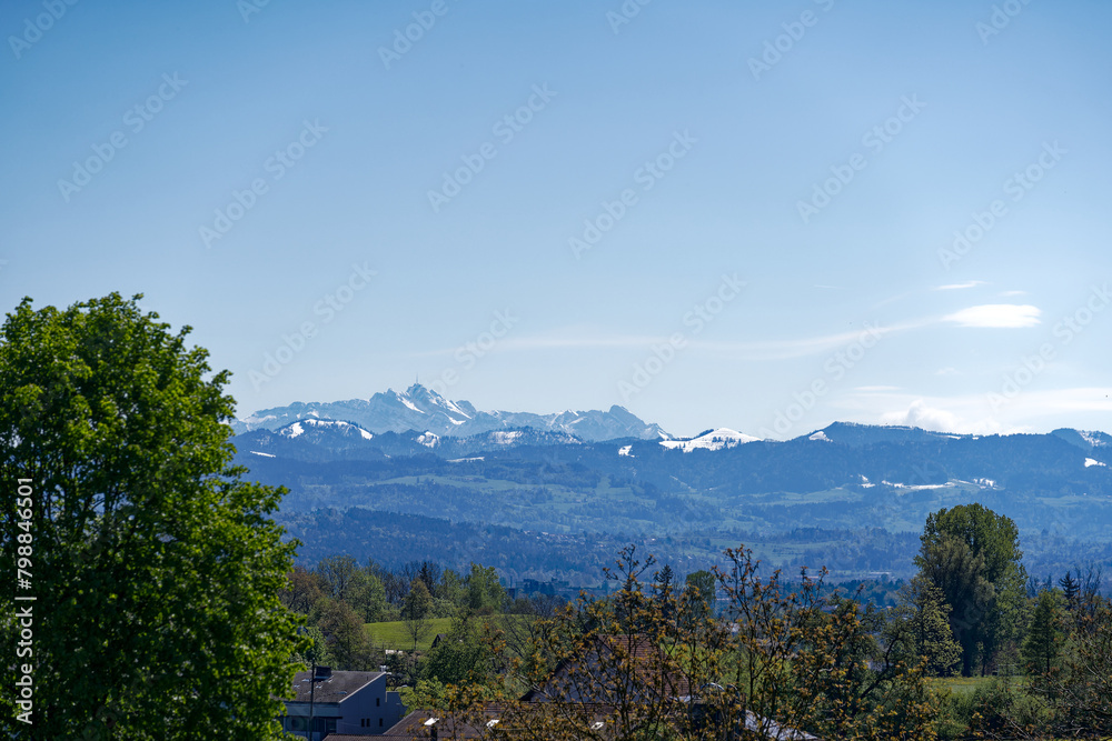 Beautiful view of mountain panorama with Alpstein and Säntis Peak seen from City of Zürich on a sunny spring day. Photo taken April 27th, 2024, Zurich, Switzerland.