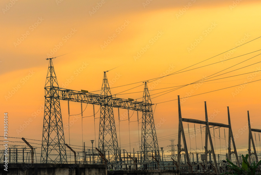 High voltage pole electric wiring distribution landscape energy engineering. Electricity energetic background with blue sky green mountain in countryside. Electric power energy engineering industrial