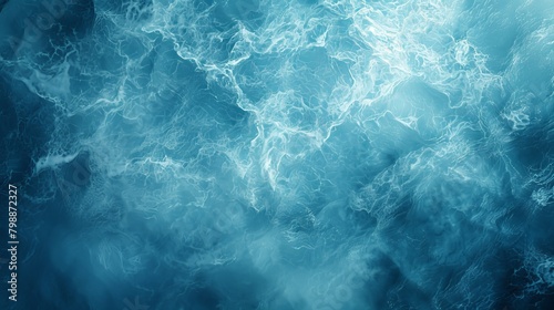 The image is a blue and white swirl of water with a blue and white background. The water appears to be in motion, creating a sense of movement and energy