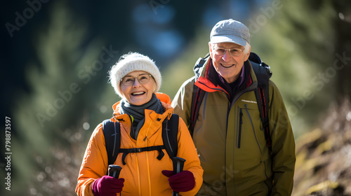 Mature caucasian couple on vacation, having a hike in the spring mountains, spending time together after retirement together travelling - tourism, pension concept