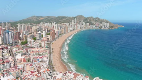 Benidorm, Spain: Aerial view of beach Playa de Levante (Platja de Llevant) in famous summer tourist resort by Mediterranean Sea, summer day with blue sky - landscape panorama of Europe from above
 photo
