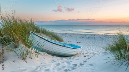 A boat sits atop a sandy beach, its hull resting on the grains of sand as it awaits its next voyage photo