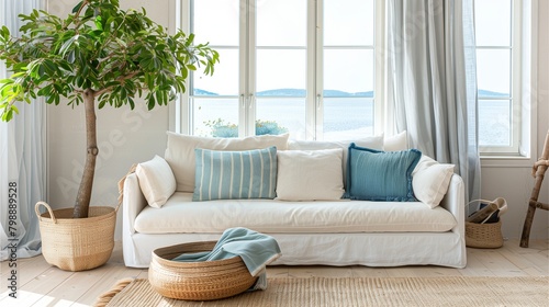 Seaside living room There is a sofa with pillows and a rattan basket decorated with green leaves. Behind the sofa there is a window overlooking the sea and mountains.Generative AI illustration.