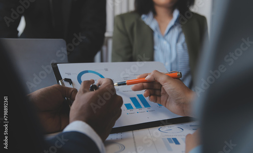 Co working conference, Business team meeting present, investor colleagues discussing new plan financial graph data on office table with laptop and digital tablet, Finance, accounting, investment. photo