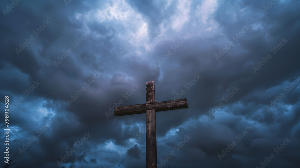 A wooden Christian cross seen from a field A wooden Christian cross seen from a field