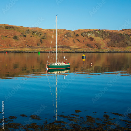 Small boat in calm water, Sound of Kerrera, Oban, Argyll and Bute, Scotland, UK.