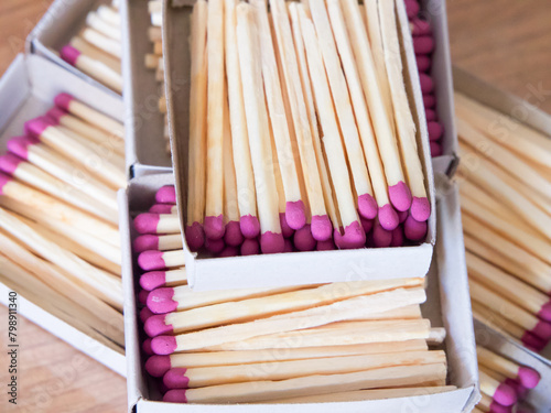 Ready-to-Strike Matches. Pink-tipped matches in boxes, symbolizing readiness. Uses for Fire safety instructions, survival guides.
