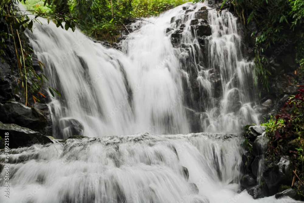 Fototapeta premium waterfall in the mountains, long exposure, curug madu