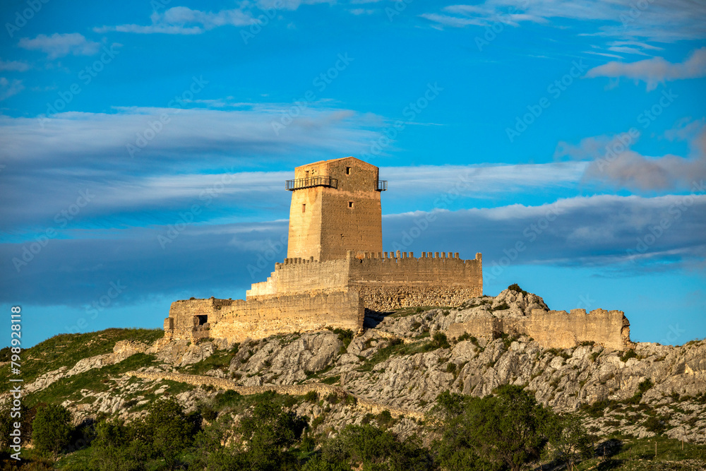 View from the distance of the medieval castle of Taibilla in Nerpio, Albacete, Castilla la Mancha, Spain with evening light