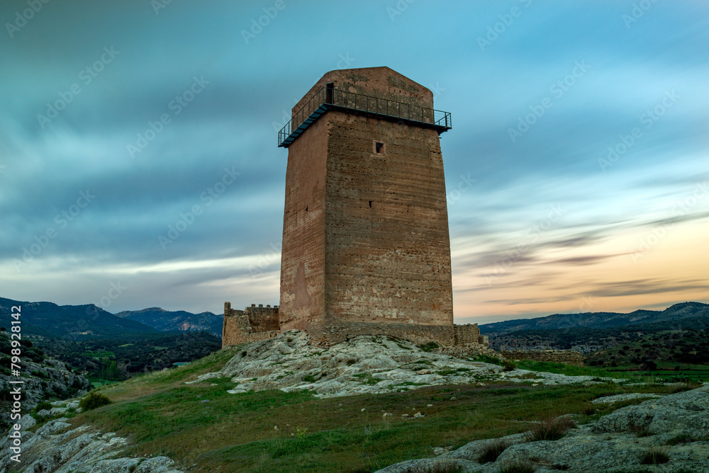 Tower of the medieval Taibilla castle in Nerpio, Albacete, Castilla la Mancha, Spain in a rocky setting at dawn Tower of the medieval Taibilla castle in Nerpio, Albacete, Castilla la Mancha, Spain in a rocky setting at dawn