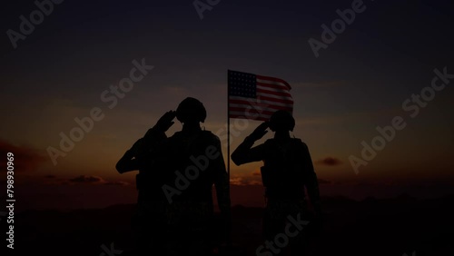 Silhouette Of A Soldier With The American Flag Stands Against The Background Of A Sunset Or Sunrise. Concept Of National Holidays. Commemoration Day