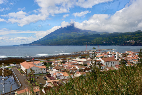 Lajes do Pico. Azores. Pico Island coast on the Atlantic Ocean. Beautiful landscape panoramic view 
of Volcano Pico in the clouds.     photo