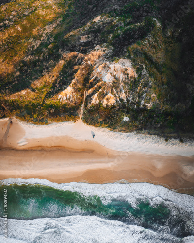 Aerial Drone view of The Pinnacles, Colored Sands on Fraser Island, Sunrise with car. Kgari, Queensland, Australia.