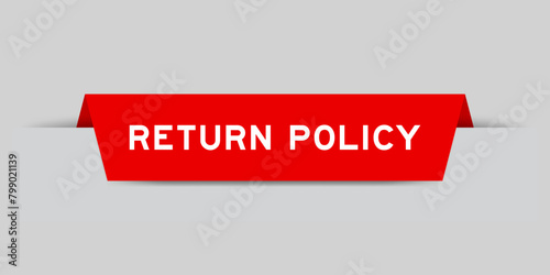 Red color inserted label with word return policy on gray background