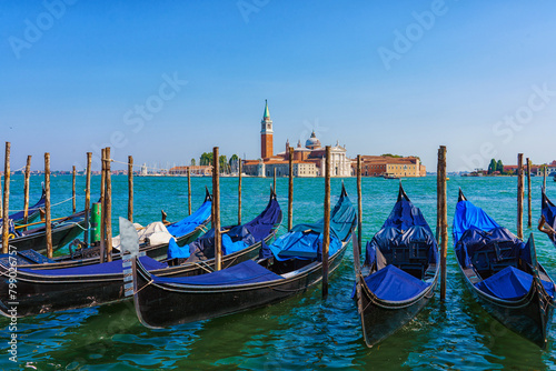 View of the gondolas of the Grand Canal on a sunny day in Venice, Italy. San Giorgio Maggiore.