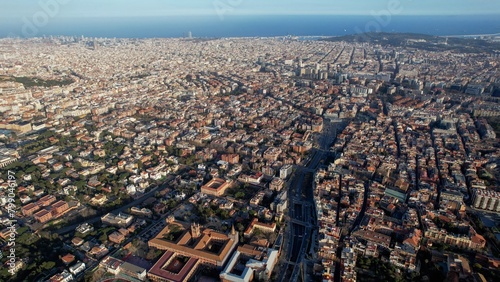 Aerial around the city of Barcelona, Spain on an early sunny morning in spring