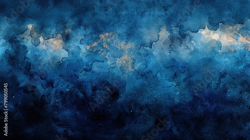 Abstract blue watercolor background with gold splashes.