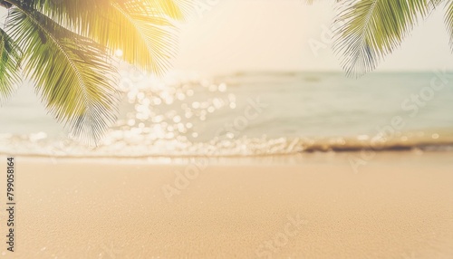 Tropical Tranquility: Blurred Palm Leaf on Beach with Bokeh Sunlight