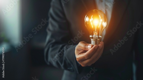 Closeup businessman holding light bulb for business problem solving. Generated AI image photo