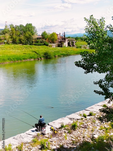 fishing along the river bank